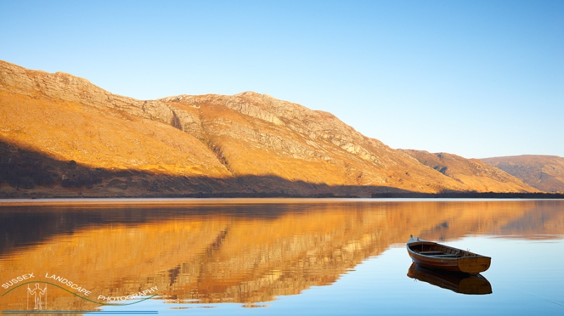slides/Loch Maree Reflection.jpg loch maree, boat, water,reflection, mountains,blue,sky,calm,peaceful, thoughtful,sunset,orange Loch Maree Reflection